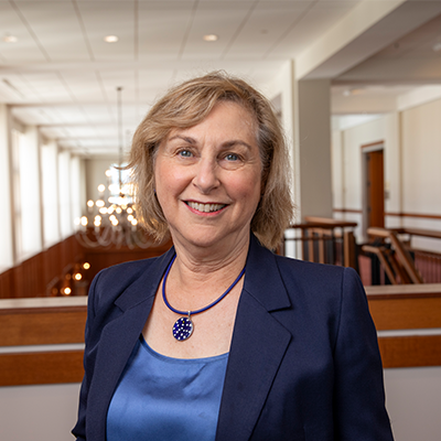 Head shot of Mary Marchant with The Inn at Virginia Tech background