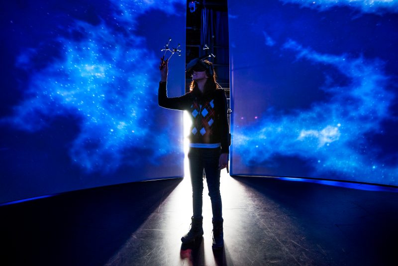 female student standing in VR studio