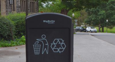 A gray trash and recycling bin on the Virginia Tech campus